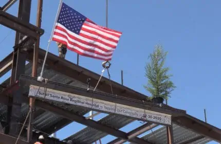 Sutter Health Santa Rosa Regional Hospital - Topping Out Ceremony - Final Beam being lifted into place with American flag waving in the breeze