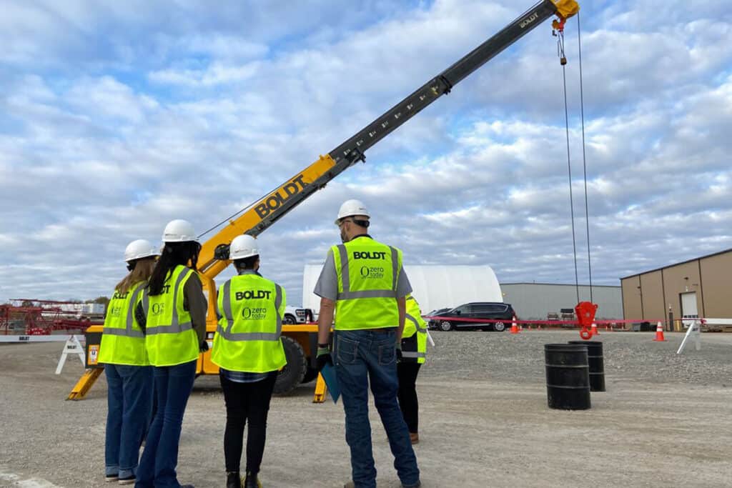 4 Boldt members standing in front of a crane as part of the Smart Girls Rock event