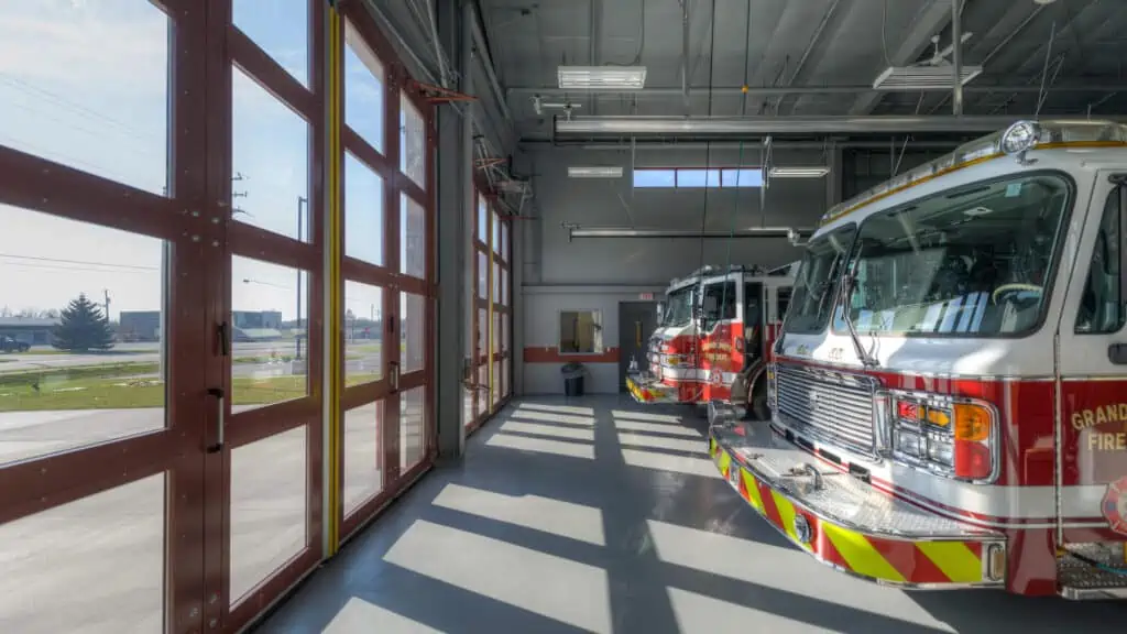 Interior view of firetrucks and building doors