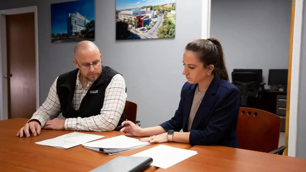 Boldt leadership member working with client in office at table