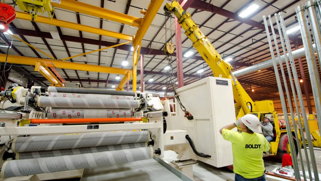 two employees working together with forklift