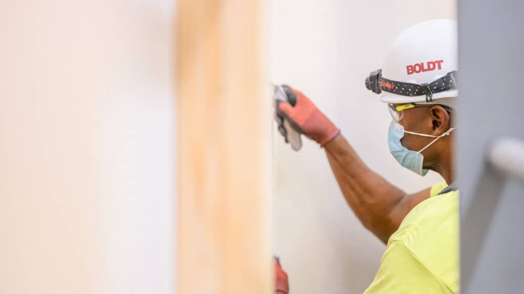 carpenter finishing a wall