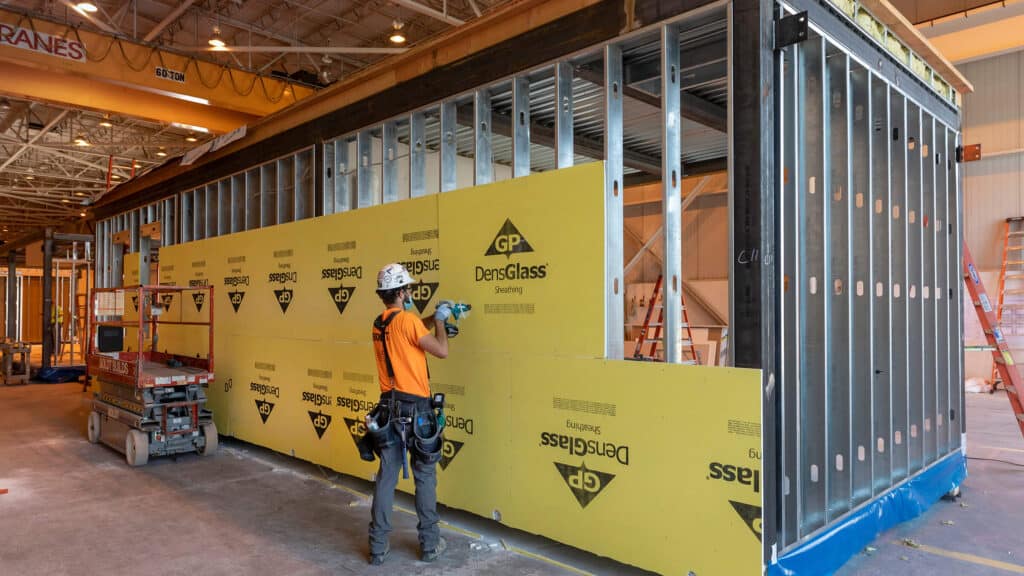 prefabrication construction - Boldt employees building modular unit