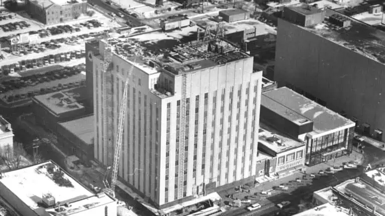 Black and white photo of office building under construction