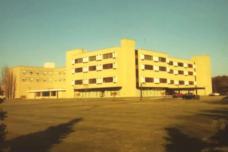 School building with grounds in the foreground