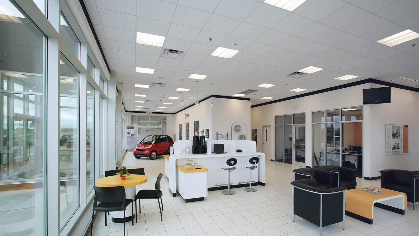 Bergstrom Automotive - Smart Car Dealership Exterior with Interior View of Seating, Offices and Information Desk