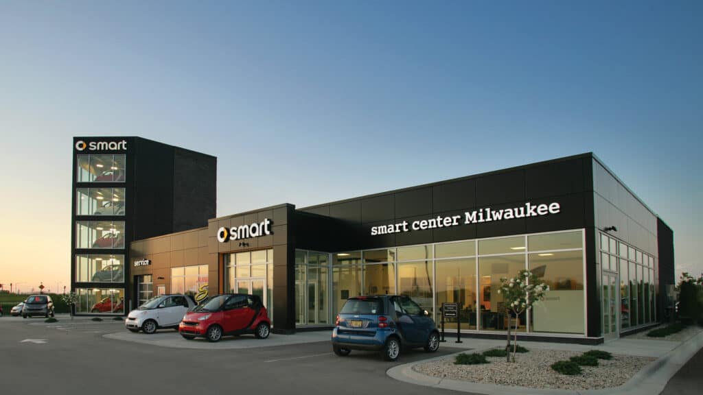 Bergstrom Automotive - Smart Car Dealership Exterior with 3 Smart Cars Parked Outside