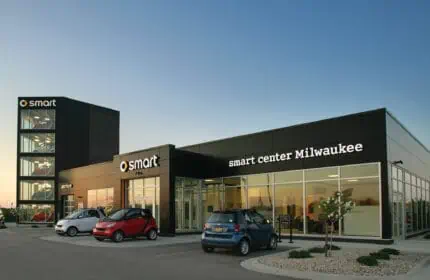Bergstrom Automotive - Smart Car Dealership Exterior with 3 Smart Cars Parked Outside