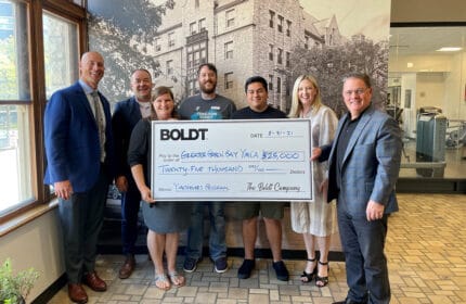 Boldt employees present oversized check to Greater Green Bay YMCA
