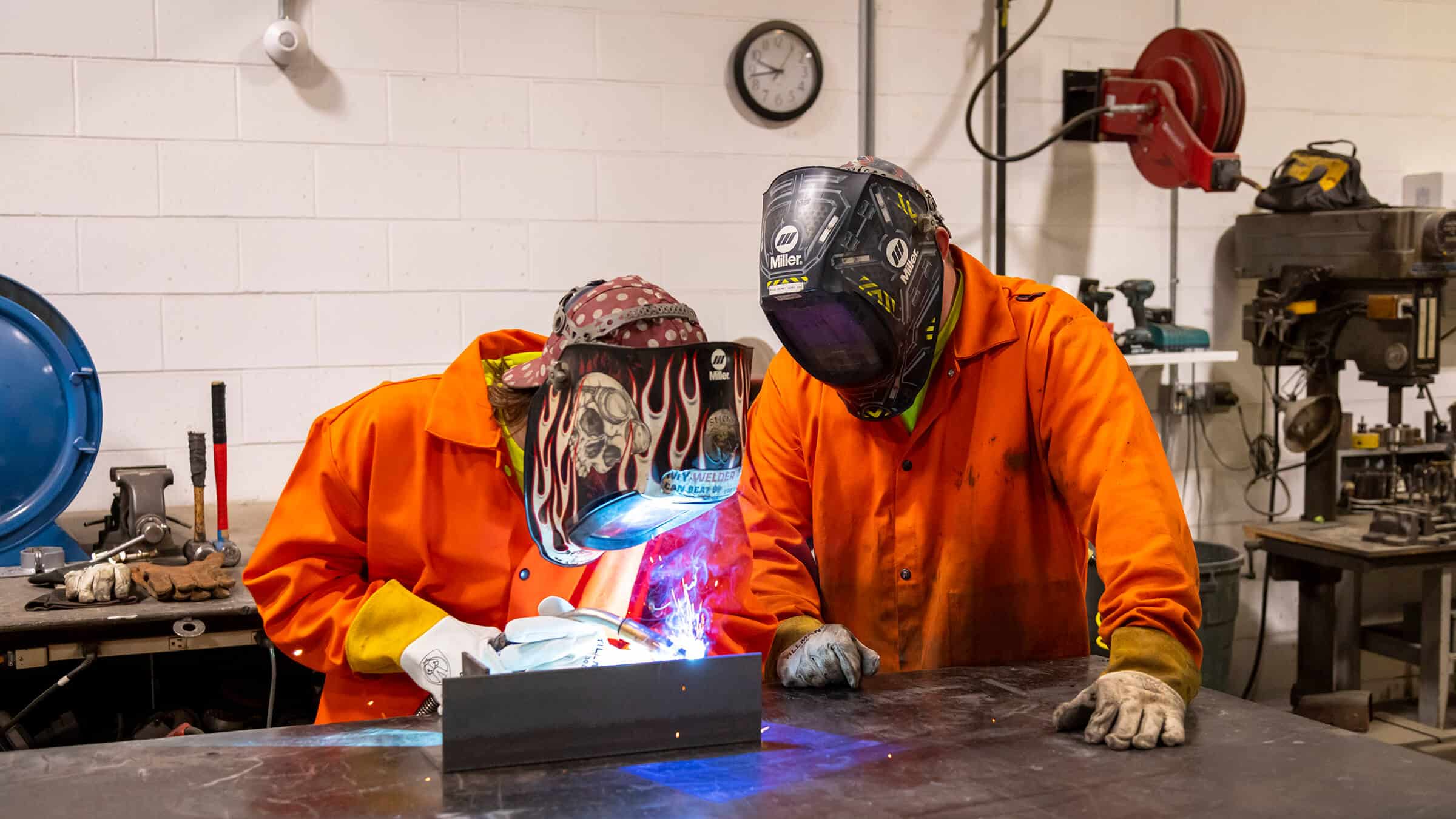 Youth apprentice learning how to weld