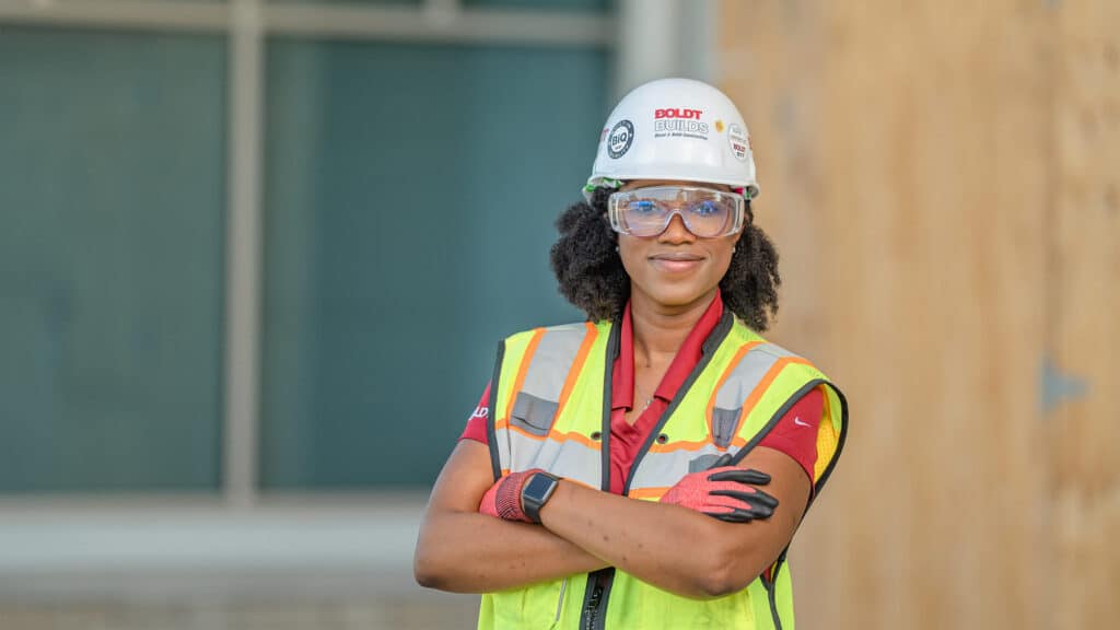 Construction woman in safety vest and hard hat