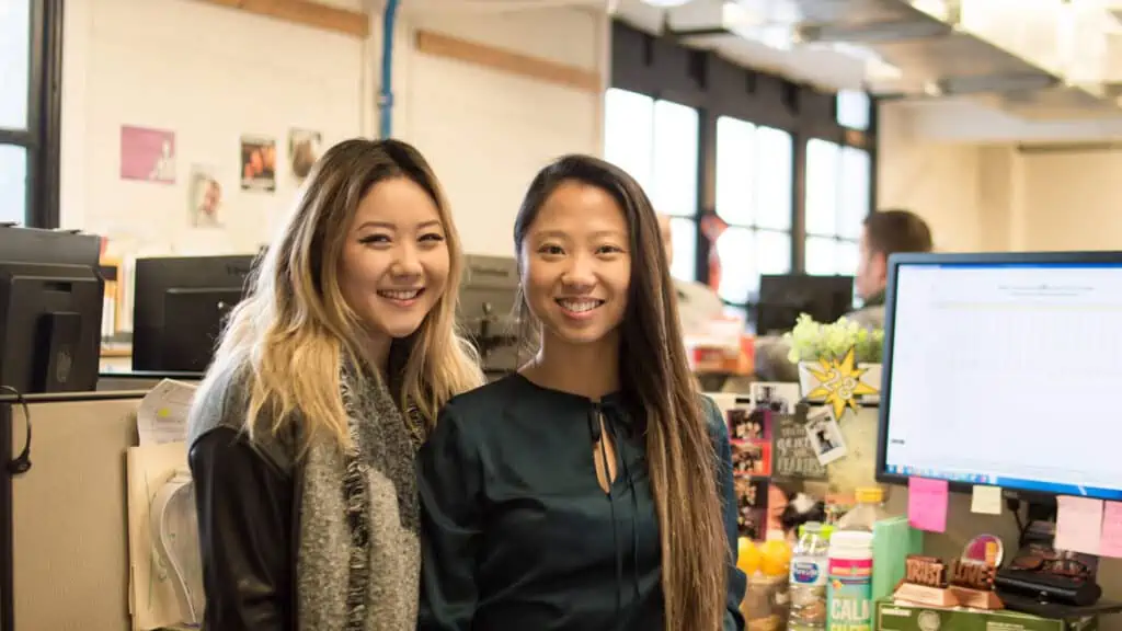 two business women inside office space