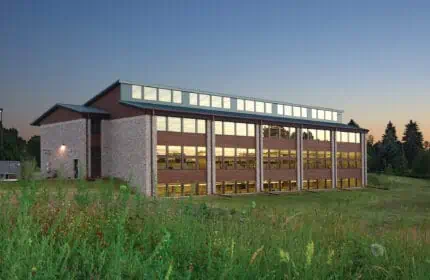 DNR Regional Headquarters and Service Center Exterior at Dusk from Prairie