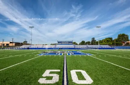 Harrah Public Schools - Evans Field 50-Yard Line