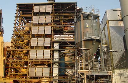 Laurentian Energy Authority - Biomass Energy Generating Facilities Exterior Facility View with Stack and Crane