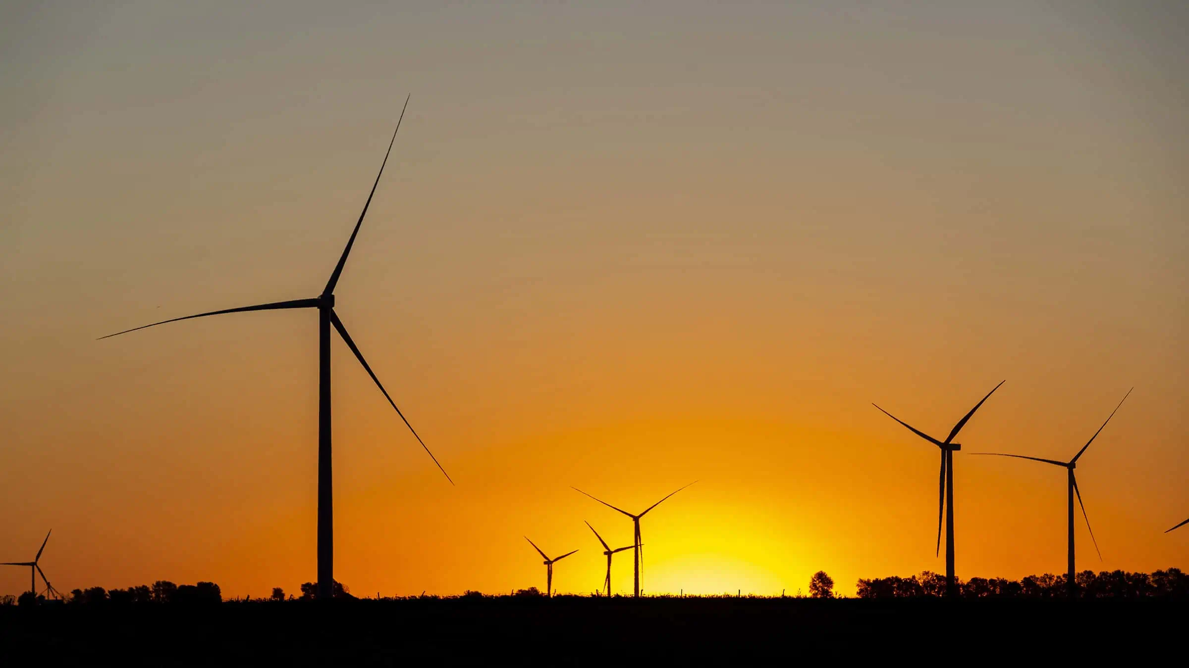 Lone Tree Wind Farm Construction Project Field of Turbines at Sunset