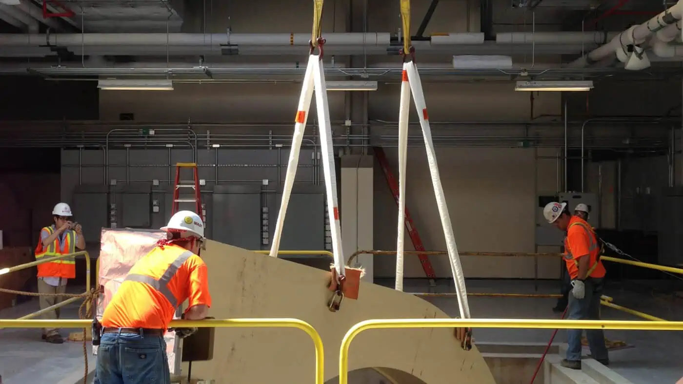 Mayo Clinic - Rochester Proton Beam Therapy Equipment Installation Lift by Crane as Construction Workers Monitor