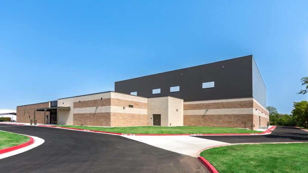 Moore Public Schools - Bring Jr. High School Gymnasium Exterior with Drive