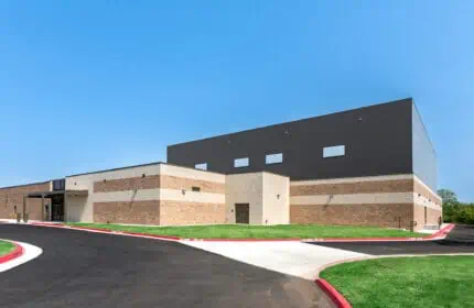 Moore Public Schools - Bring Jr. High School Gymnasium Exterior with Drive