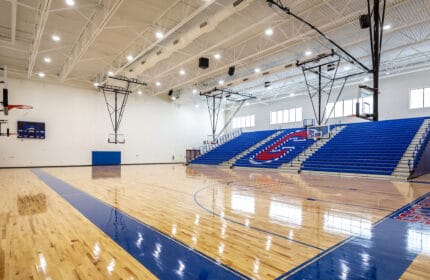 Moore Public Schools - Central Jr. High School Gymnasium Basketball Court and Bleachers