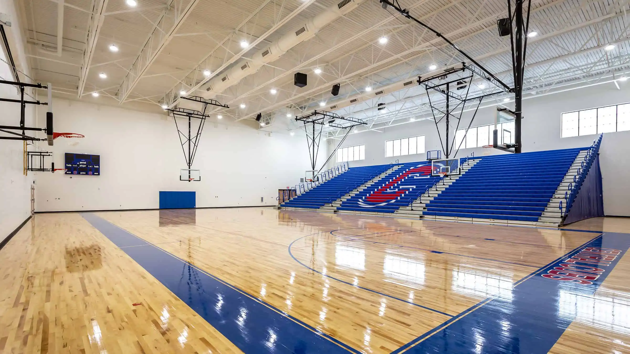 Moore Public Schools - Central Jr. High School Gymnasium Basketball Court and Bleachers