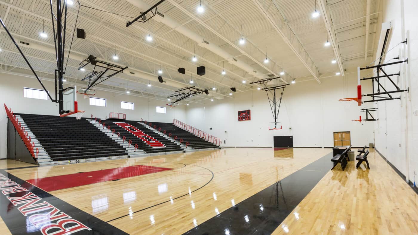 Moore Public Schools - Highland West Jr. High School Gymnasium Basketball Court and Bleachers