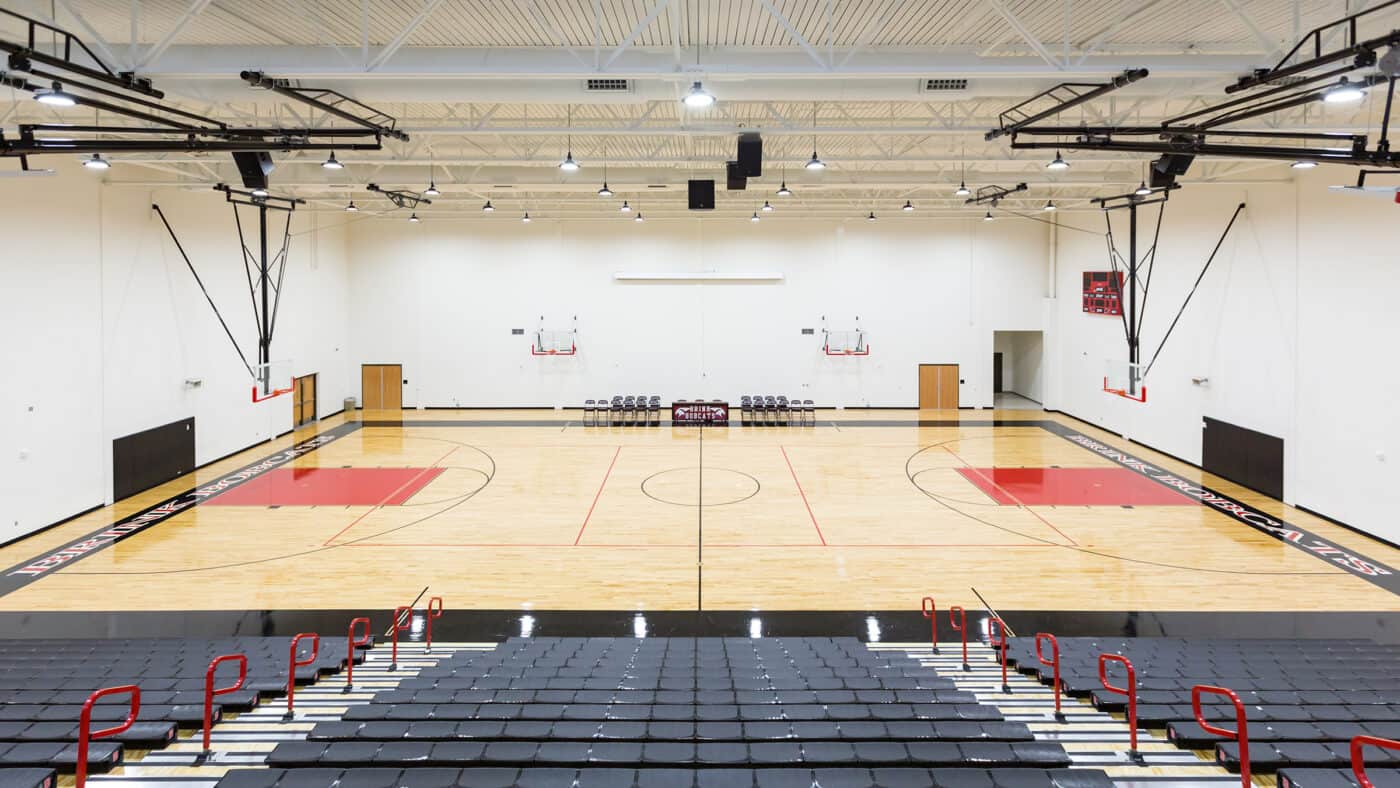 Moore Public Schools - Highland West Jr. High School Gymnasium Basketball Court and Bleachers