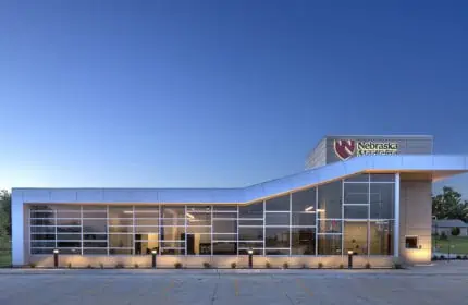 Nebraska Medicine - Primary Care Clinic Exterior Lit at Dusk