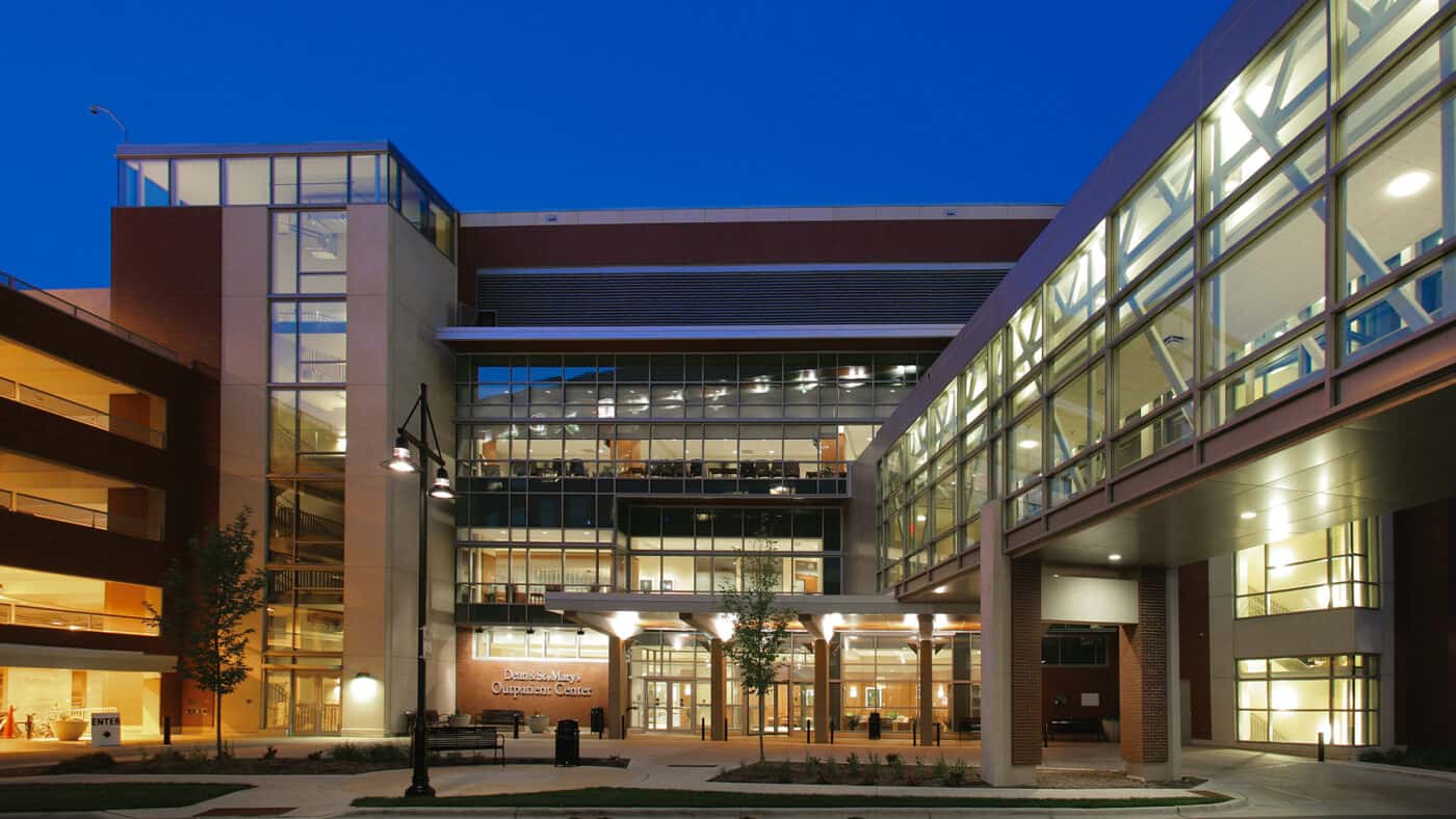 SSM Health - St. Mary's Hospital Outpatient Center with Skyway Connecting Two Buildings Lit at Dusk