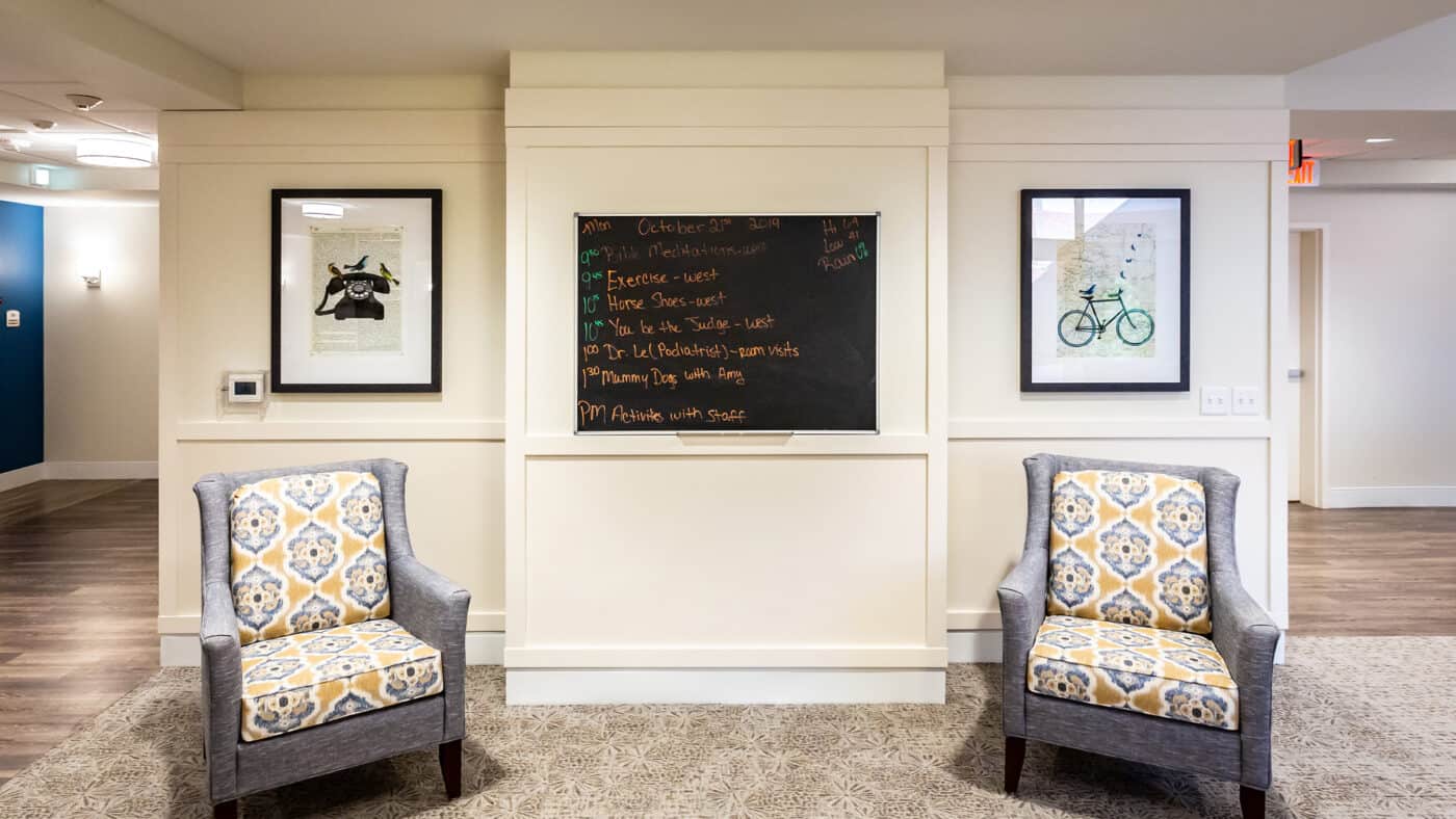 Spanish Cove Retirement Community Seating with Artwork and Chalkboard on Wall