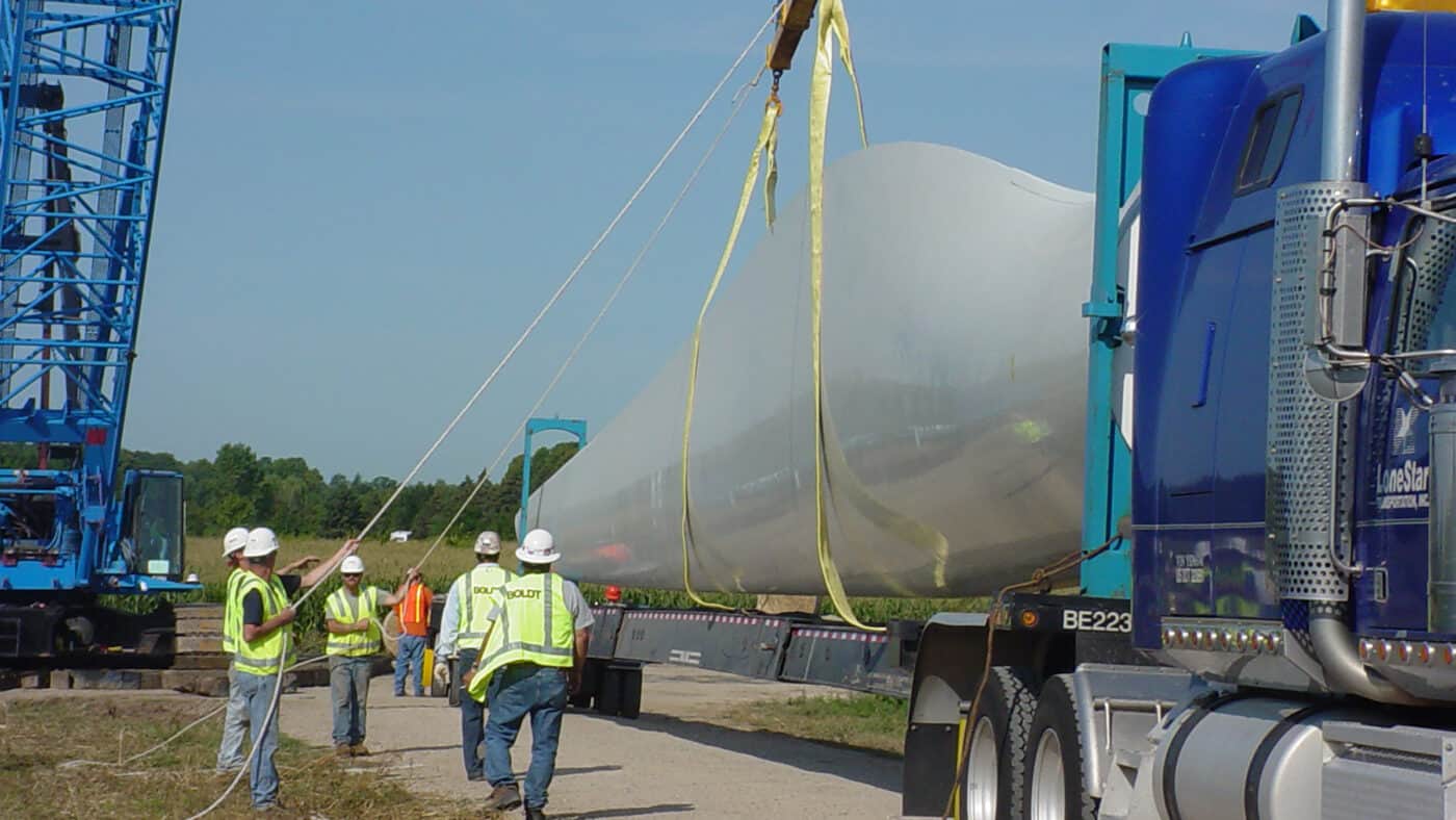 St. Olaf College - Arrival of Wind Turbine on Semi Trailer before Installation with Boldt Employees Preparing to Unload with Crane
