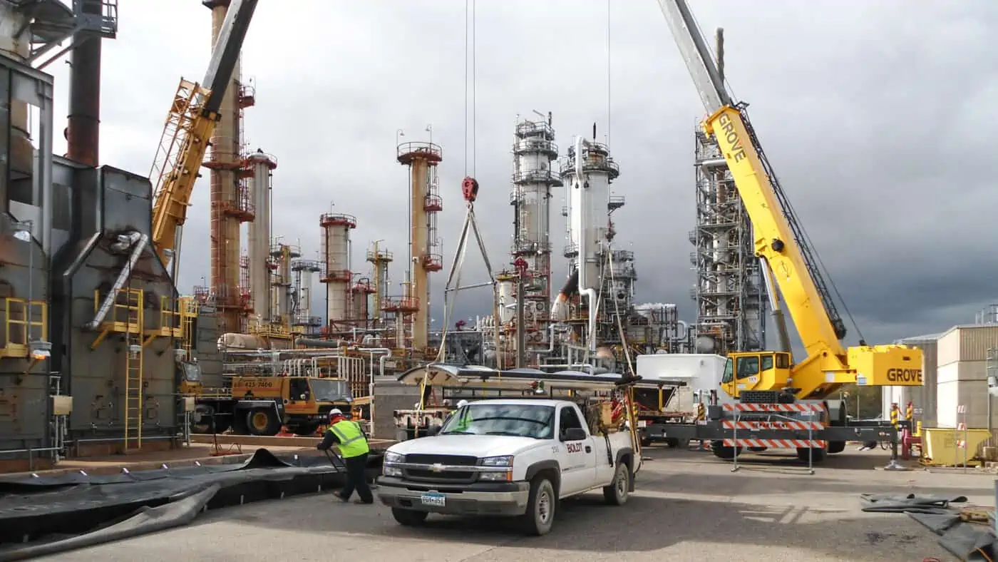 St. Paul Park Refinery, Mutiple Cranes on Site during Construction and Equipment Installation, with Boldt Employee and Truck in Foreground