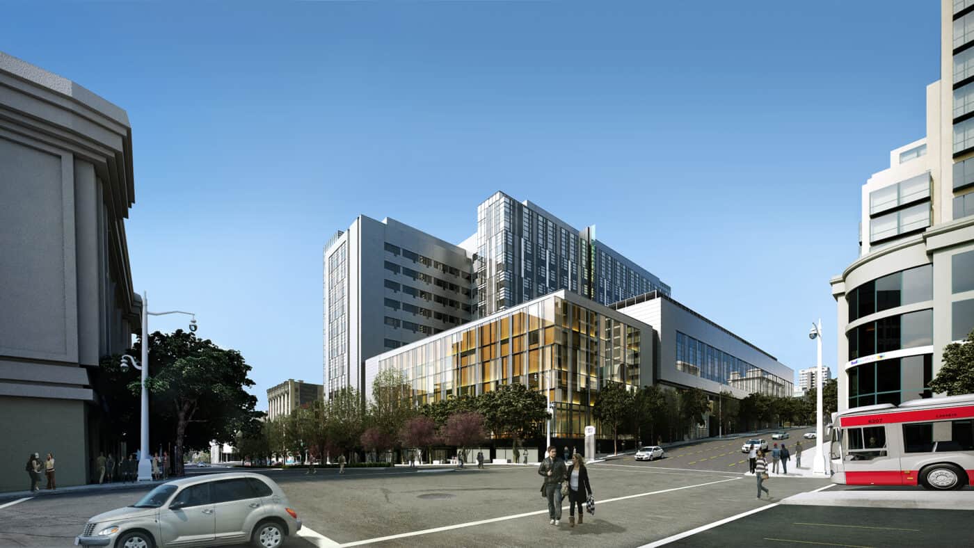 Sutter Health CPMC Van Ness Campus Hospital Exterior View of Building at Busy Intersection with Traffic in Foreground