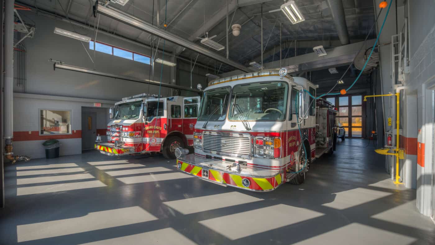 Town of Grand Chute - Fire Station #2 Interior View of Truck Bays with Trucks Parked Inside