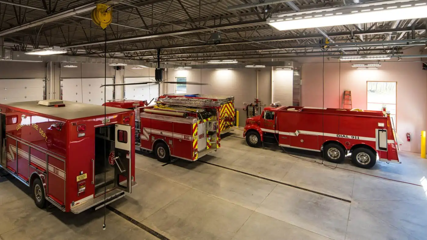 Town of Ledgeview Municipal Building - Interior View of Firetruck Bays with Trucks Parked Inside, Overhead Bay Doors Closed