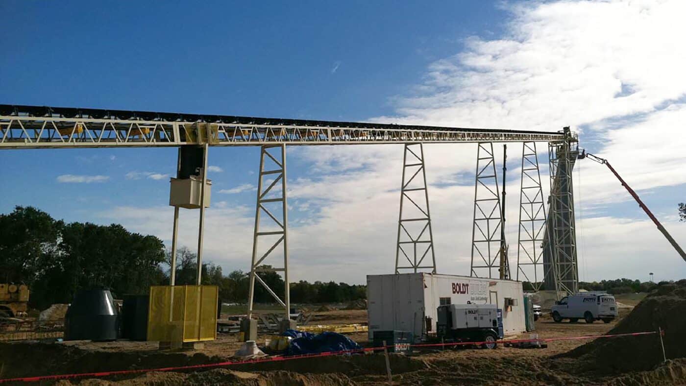 U.S. Silica Frac Sand Mine Exterior View of Conveyor System during Construction with Crane and Construction Trailer Visible