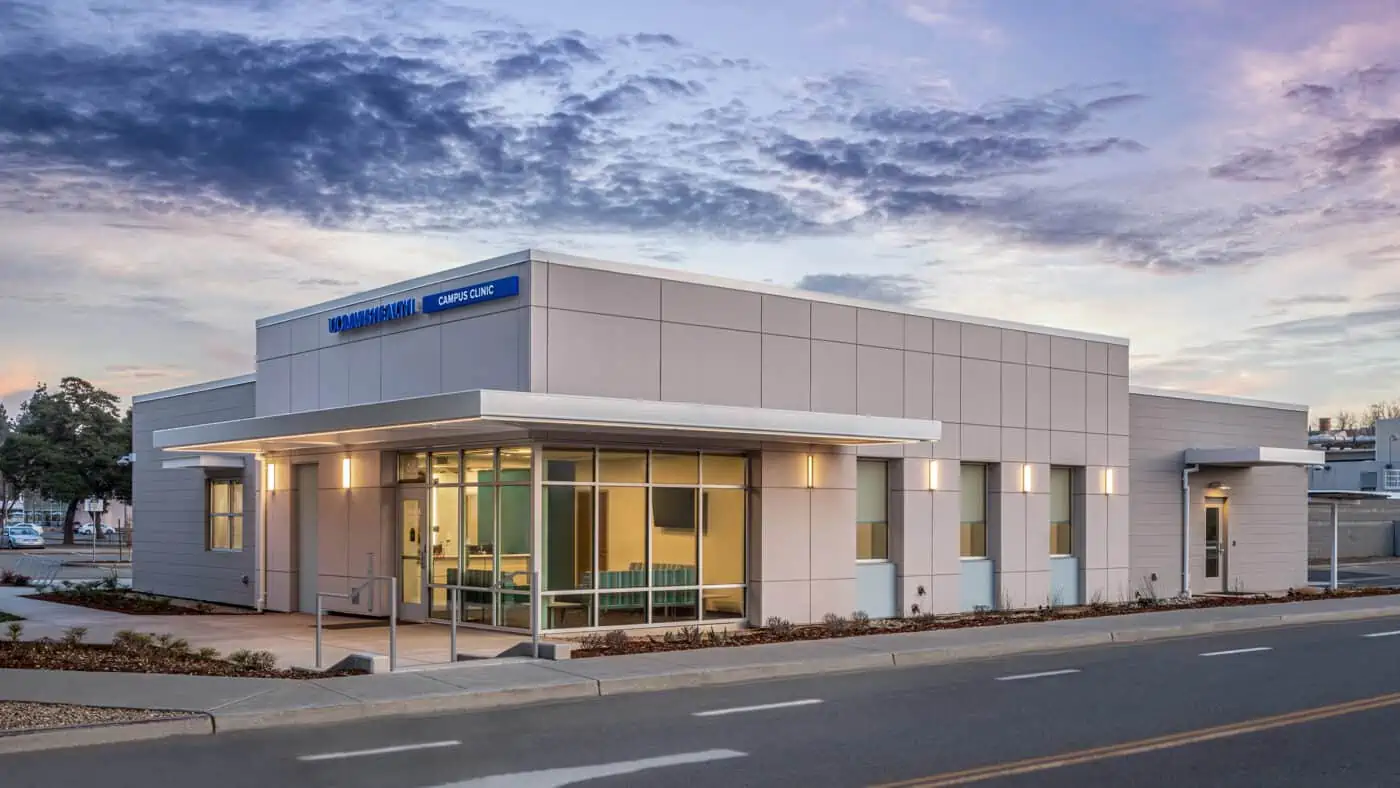 University of California - Davis - Health Clinic - Exterior View of Building at Dusk from Street