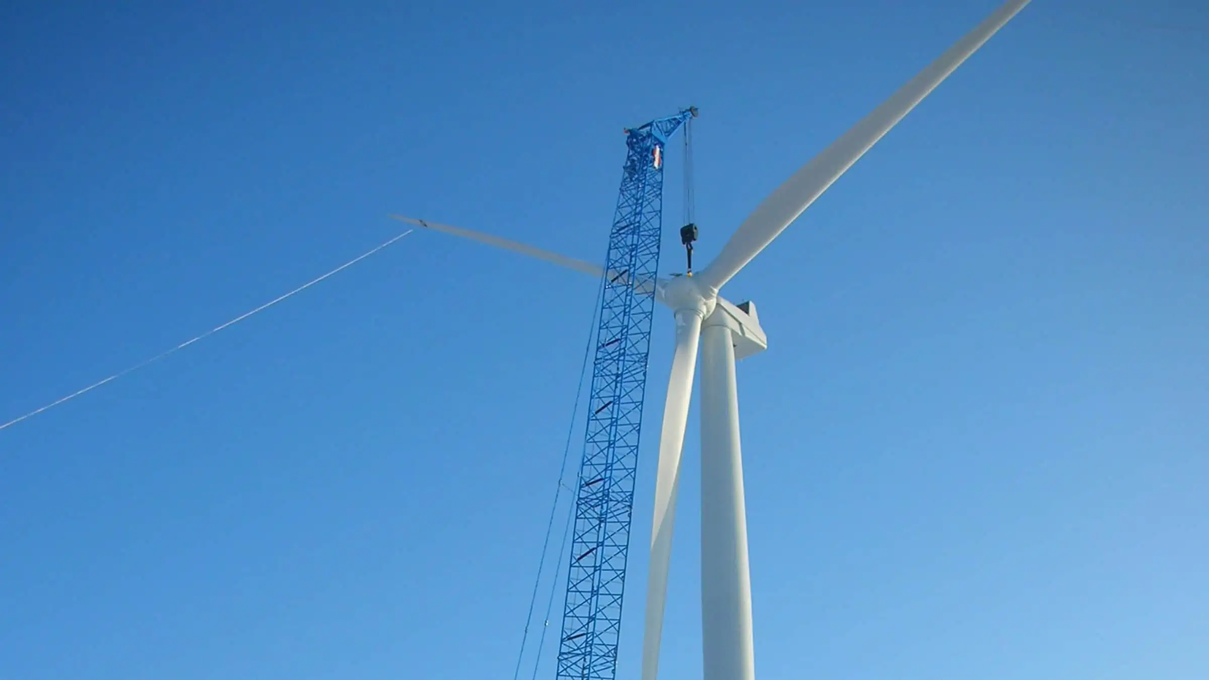 WE Energies - Wind Turbine Erection - Crane Lifts Blades onto Tower