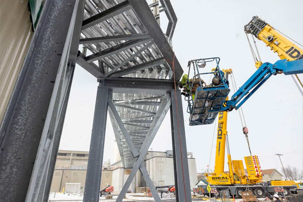 Construction workers installing bridge