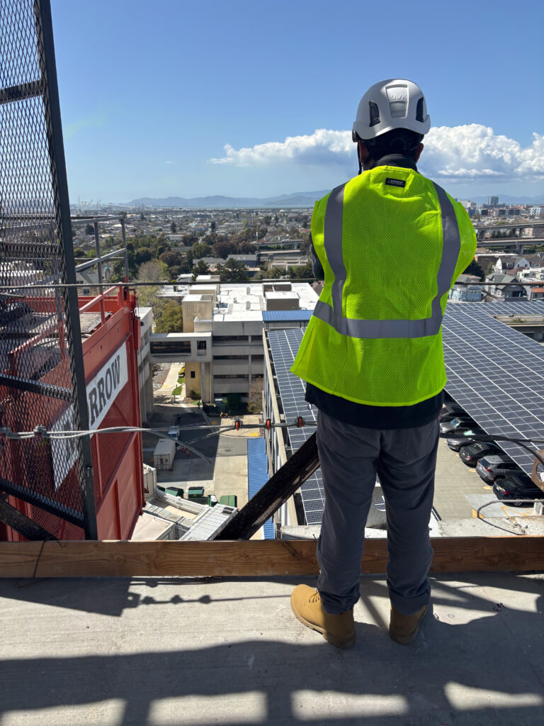 Work study student looks over project site.